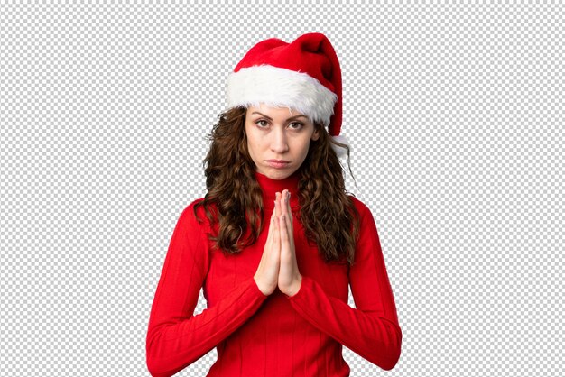 Menina com chapéu de Natal suplicando