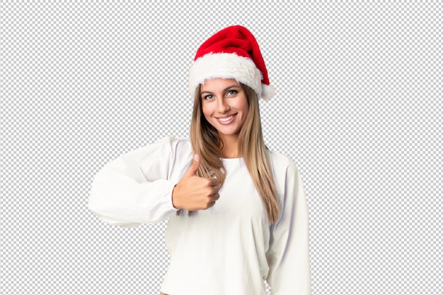 Menina loira com chapéu de Natal, dando um polegar para cima gesto