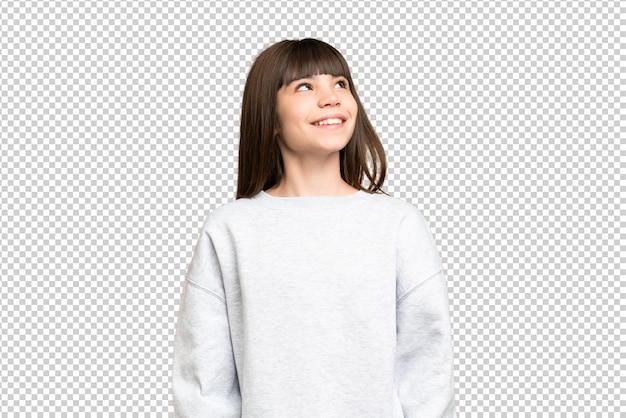Menina sobre isolado verde chroma chave fundo pensando em uma ideia enquanto olhava para cima