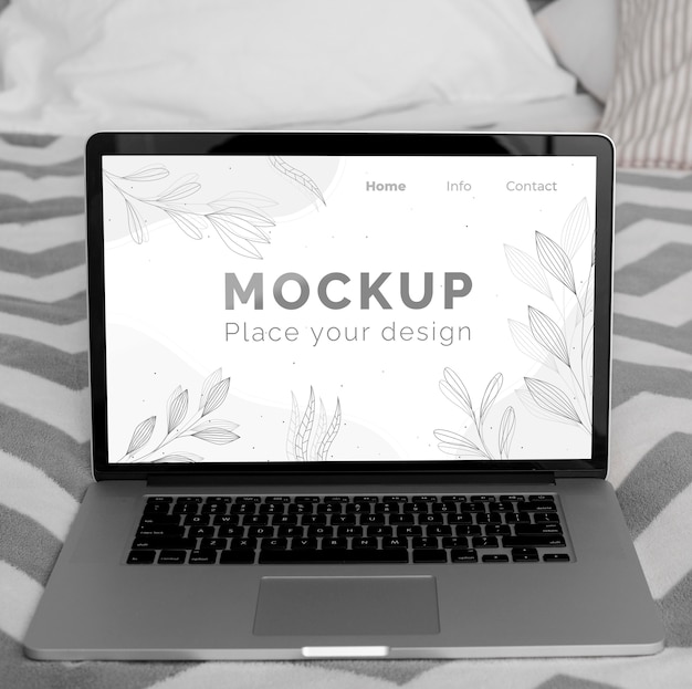 Mock up laptop sul letto