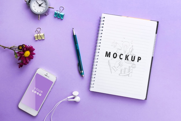 mock-up notebool and clock on table