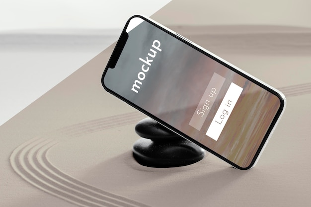 Mock-up-telefon in sandkomposition