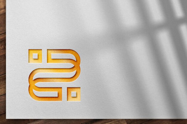 Mockup de logotipo dourado em textura de papel branco com sobreposição de sombra