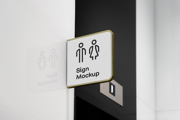 Mockup de sinal de banheiro em uma parede branca