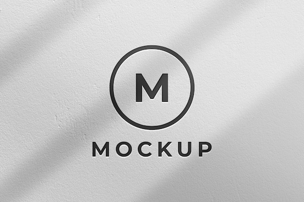 Mockup del logo aziendale nero sul muro