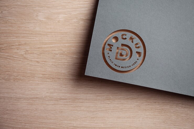 PSD mockup del logo con ritaglio di carta grigia vista dall'alto