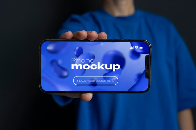 Mockup dello schermo del telefono della tenuta della mano