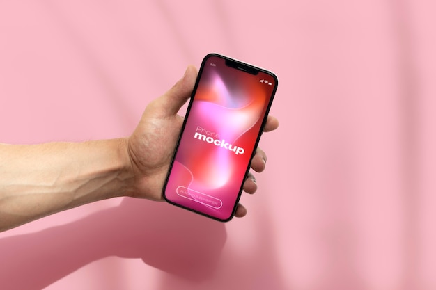 Mockup dello schermo del telefono della tenuta della mano