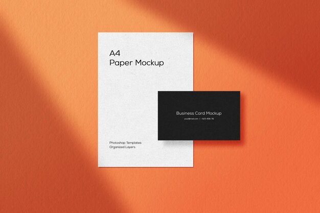 Mockup di biglietto da visita nero con amplificatore di carta A4