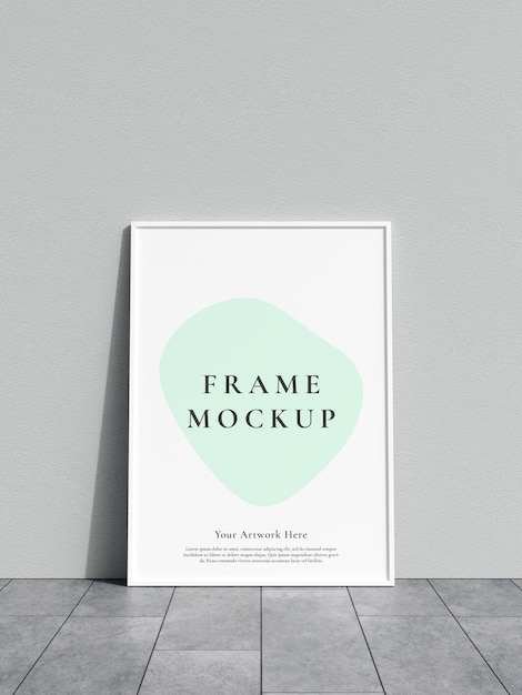Mockup di cornice appoggiato a un muro bianco sul pavimento di marmo