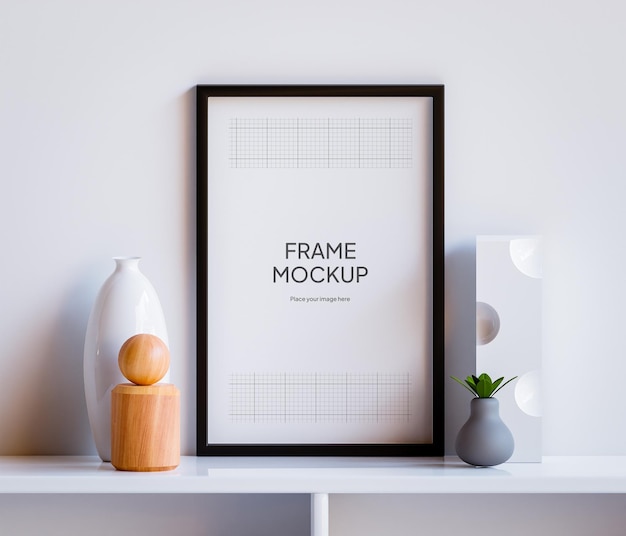 Mockup di cornice per foto PSD sul tavolo con parete bianca del soggiorno con decorazione estetica e vegetale