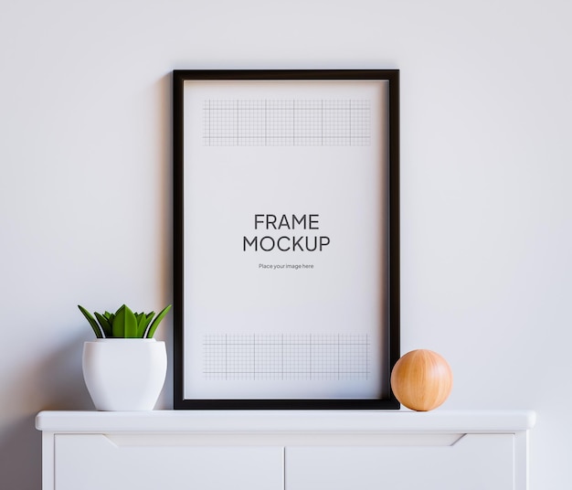 Mockup di cornice per foto PSD sul tavolo con piante e parete bianca della decorazione del soggiorno in legno