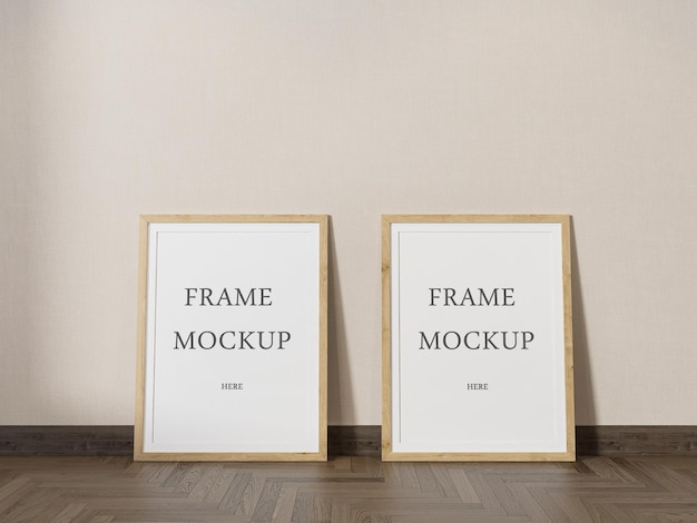 Mockup di due cornici in legno posizionate su parquet scuro