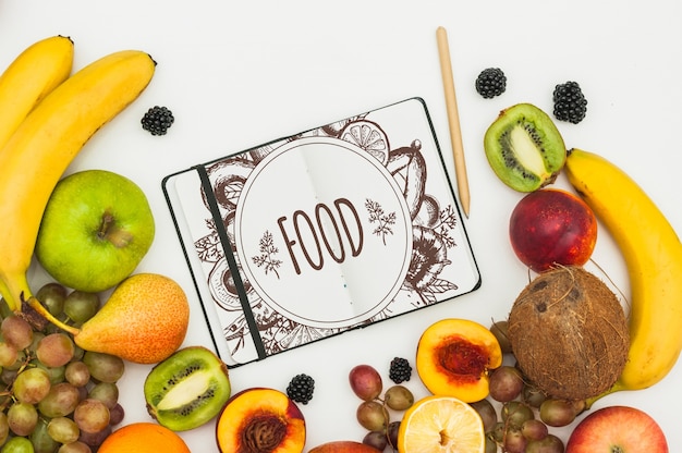 Mockup di libro aperto con frutti