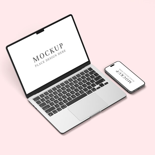 Mockup di portatile e smartphone su superficie rosa