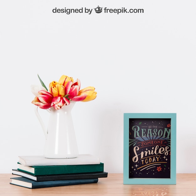 Mockup di telaio e pianta sui libri