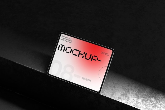 Mockup elegante de tableta en superficie oscura para la presentación de dispositivos modernos