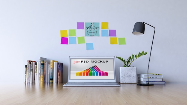 Mockup de espacio de trabajo con portátil y notas adhesivas