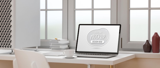 Mockup laptop auf weißem tisch neben dem fenster