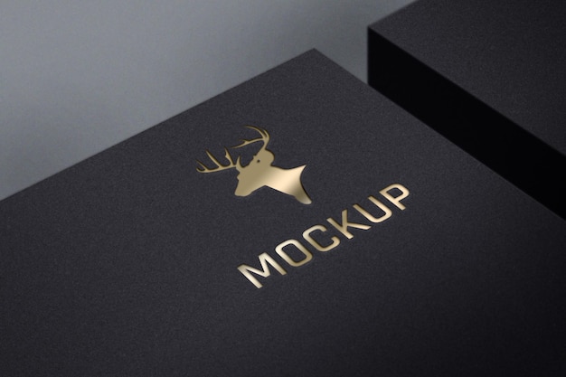 Mockup logo di lusso dorato su scatola nera