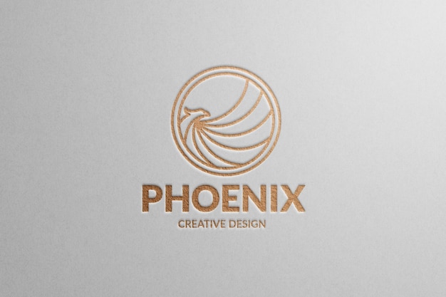 Mockup del logotipo de Phoenix en papel blanco con papel de bronce