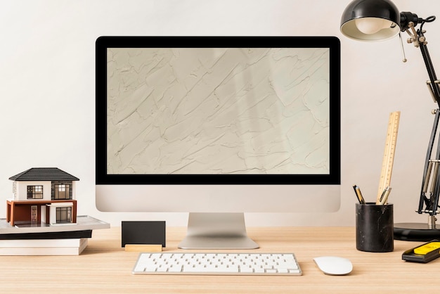 Mockup de pantalla de computadora espacio de trabajo mínimo para arquitecto psd
