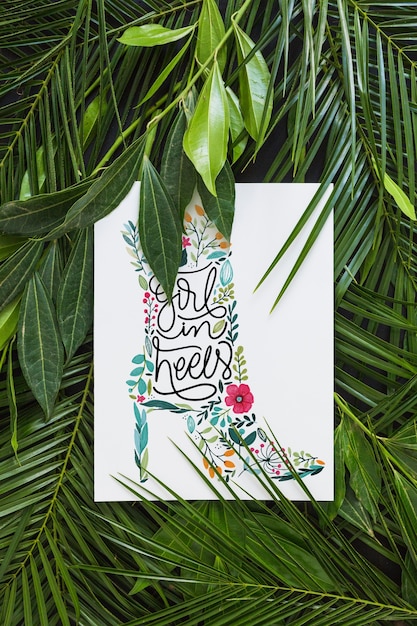 Mockup de papel dentro de hojas tropicales