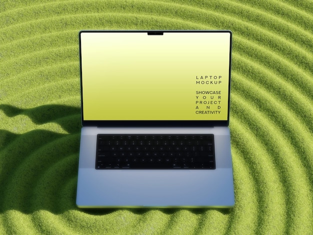 Mockup de portátil en una superficie de hierba verde con textura