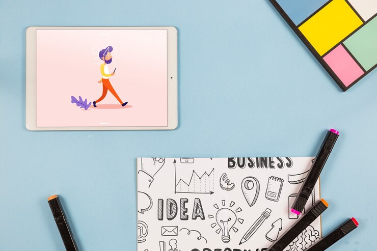 PSD mockup tablet tampilan atas dengan elemen meja