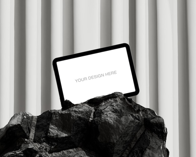 Mockup de tableta en roca con pantalla en blanco