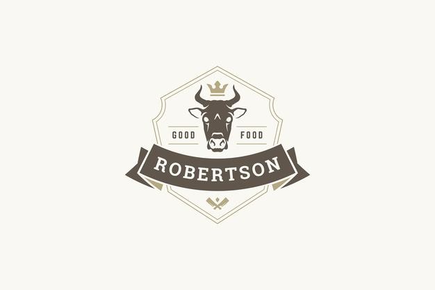 Modèle de conception de logo vintage de boucherie de qualité supérieure tête de vache dans une couronne bouclier héraldique avec ruban
