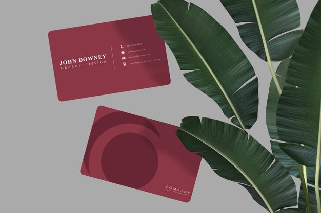 Modello moderno di mockup di biglietti da visita con foglie di banana per la presentazione della pubblicità dell'identità aziendale di branding