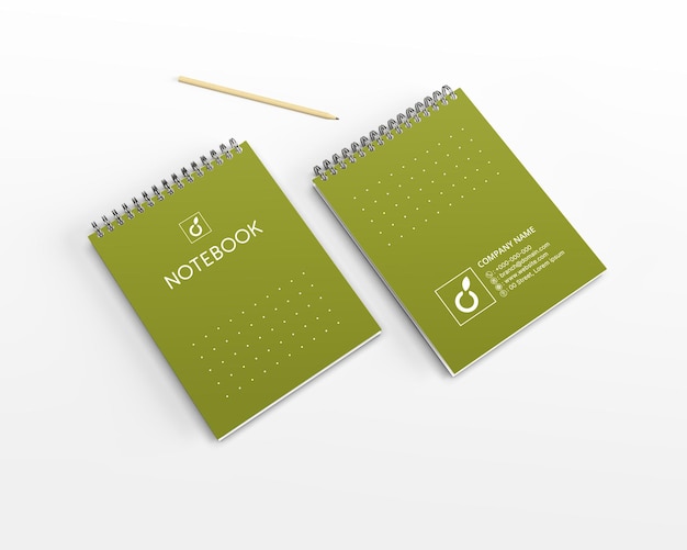 Modelo de caderno verde em superfície branca