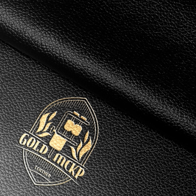 PSD modelo de logotipo de efeito dourado em couro preto