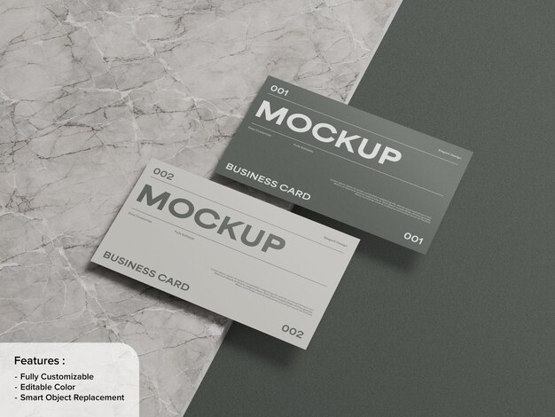 Modelo de tarjeta de visita moderna con dos tarjetas posicionadas en un diseño minimalista en una superficie de mármol