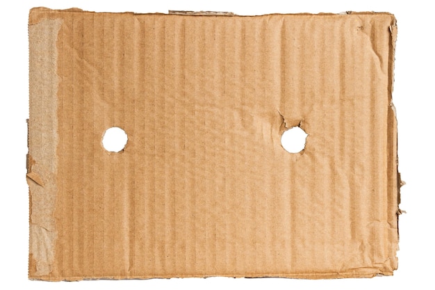 Des morceaux de carton sur un fond vide