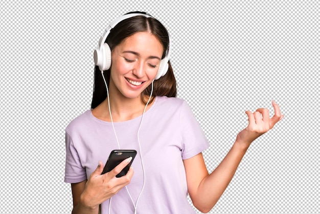 PSD mujer bonita joven escuchando música con sus auriculares