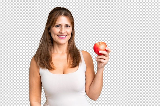 PSD mujer de mediana edad con una manzana sobre un fondo aislado sonriendo mucho