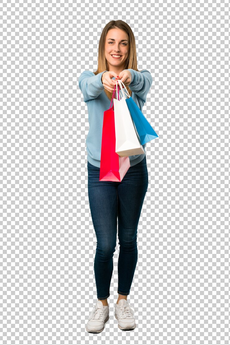 PSD mujer rubia con la camisa azul que sostiene muchos bolsos de compras