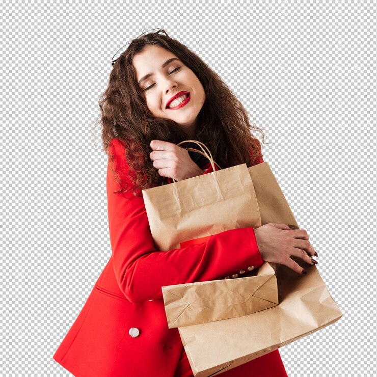 PSD mujer sonriente de la venta que sostiene bolsos de compras