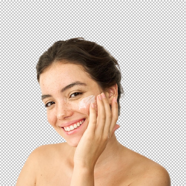 Mulher aplicando creme no rosto conceito de cuidados com a pele e beleza