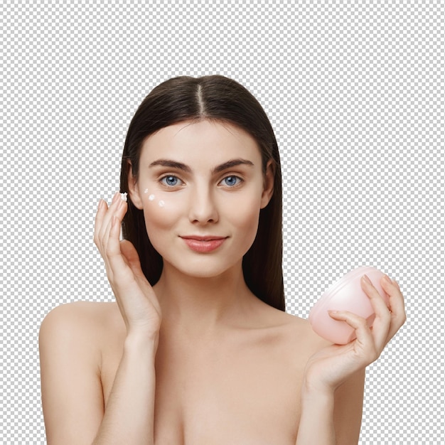 Mulher atraente aplica creme facial produto anti-envelhecimento