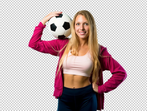 Mulher bonita do esporte segurando uma bola de futebol