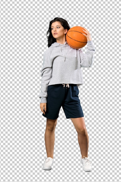 Mulher jovem, jogando basquetebol