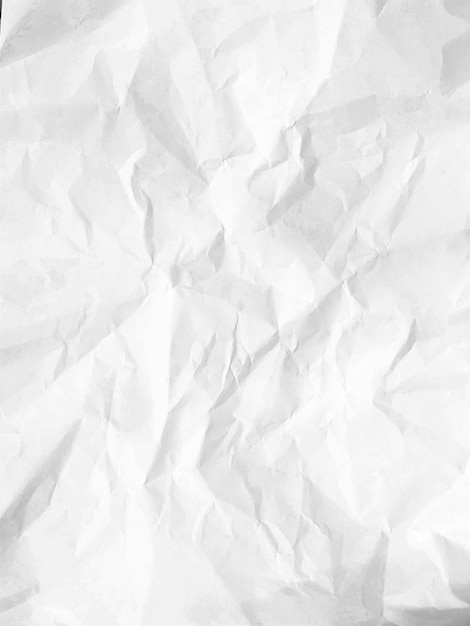 Nahaufnahme der Textur eines weißen, zerknitterten Papiers