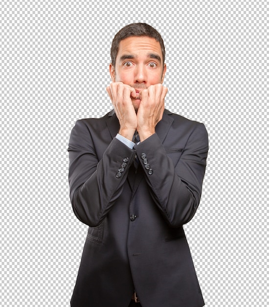 Nervioso joven empresario posando