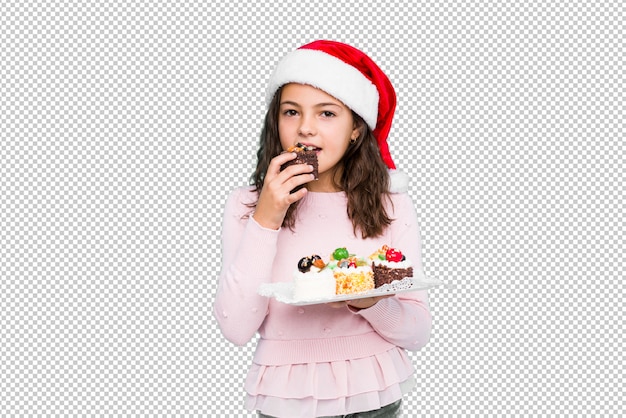 PSD niña sosteniendo dulces celebrando el día de navidad