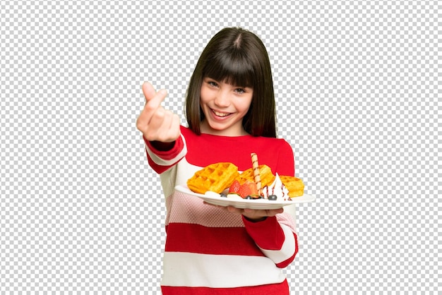 Niña sosteniendo gofres sobre un fondo aislado de clave de croma haciendo gesto de dinero