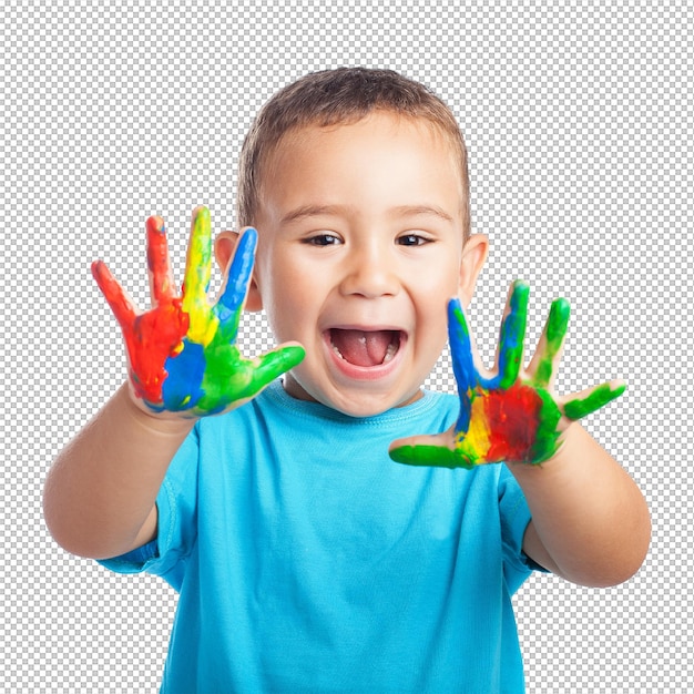 Niño pequeño con las manos llenas de pintura y con la boca abierta