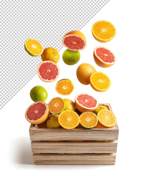 Oranges et mandarines tombant sur une boîte en bois